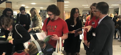 people chatting at a careers fair